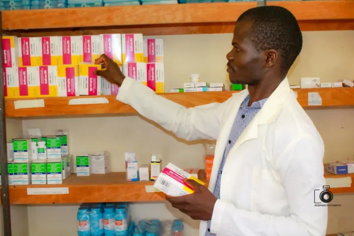 A MED25 pharmacist stocking shelves in the hospital pharmacy